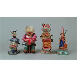 LOT OF FOUR TIN W/UP TOYS. 