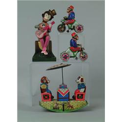 LOT OF FOUR W/UP MONKEY TOYS. 