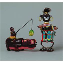 LOT OF TWO BLACK TIN W/UP TOYS.