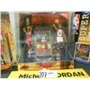 Image 3 : Michael Jordan Poster Book and Collectible Figures.