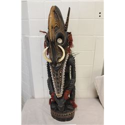 PAPAU NEW GUINEA CARVED WOODEN CROCCODILE MAN. FEATURING NASSA SHELLS EMBEDDED IN DARK BROWN RESIN