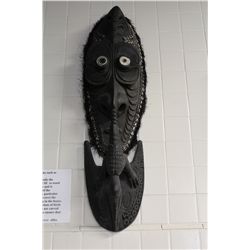 PAPAU NEW GUINEA CARVED WOODEN SPIRIT SPIRIT HOUSE MASK FEATURING NASSA SHELLS EMBEDDED IN DARK