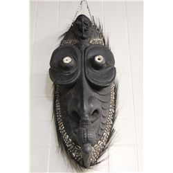 PAPAU NEW GUINEA CARVED WOODEN SPIRIT SPIRIT HOUSE MASK FEATURING NASSA SHELLS EMBEDDED IN DARK