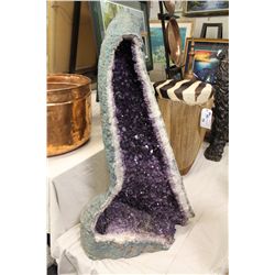 AMETHYST GEODE 48  HIGH 28  WIDE AT THE BASE. WEIGHS APPROX. 500LBS AND HAS A CRACK ON THE BACK