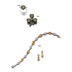 AN ANTIQUE DIAMOND AND DEMANTOID GARNET RING...