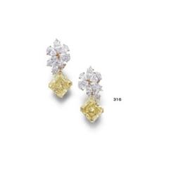 VAN CLEEF & APRELS A PAIR OF FANCY YELLOW DIAMOND AND DIAMOND EARPENDANTS the tops of cluster d...