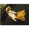 Image 1 : Porcelain Doll With Musical Cart doll is approx 12" tall the cart is 7" x 5" x H 5.5  new condition 