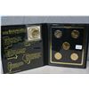 Image 1 : A set of cased 2003 gold plated State quarters and a gold plated Sacagawea dollar coin