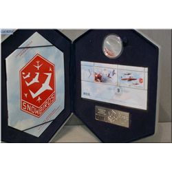 A hard cased 2006 Canadian Forces Snowbirds 99.99% pure silver hologram 5 dollar coin and stamp set