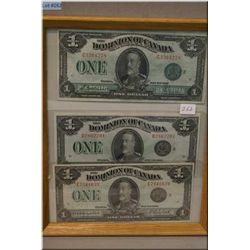 Three Canadian 1928 George V one dollar bills