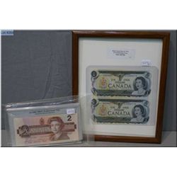 Framed Canadian 1973 uncut EAX replacement $1 bills and 1986 replacement $2 bill