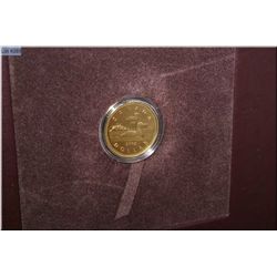 Canadian 2002 ?Going for the Gold? binder featuring gold plated loonie, commemorative postage stamps