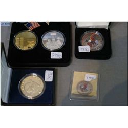 Three US boxed coin sets including Twin towers and Afghanistan, coloured American one dollar, Libert