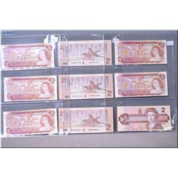 Twelve Canadian 2 dollar bills including five 1975 and seven 1986