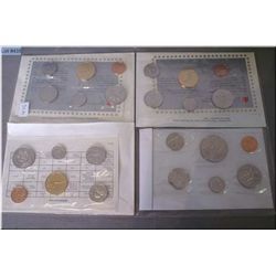 Four un-circulated Canadian coin sets including 1987,88,89 and 1990