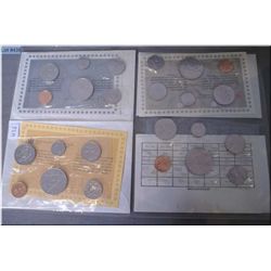Four Canadian un-circulated coins sets including 1983, 84, 85 and 1986