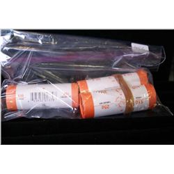 Three rolls of Canadian loonies including one "Lest We Forget" with red poppy, two rolls of 2007 Spe