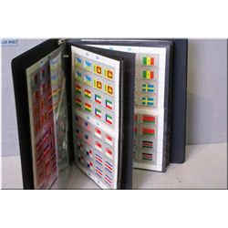 A binder of Flags of the United Nations postage stamps