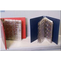 Two coin collector binders filled with assorted foreign coins