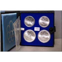 Set of four sterling silver 1976 Montreal Olympic coins including two $5 and two $10 coins