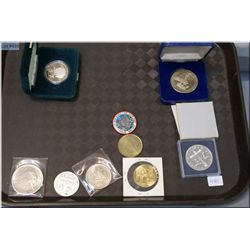 A selection of coins and tokens including 1982 Regina dollar, 1984 Jacques Cartier, 1979 Mining toke