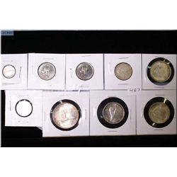 Selection of Canadian coins including 1967 dollar, three 50 cent pieces, quarter, nickel, dime plus 