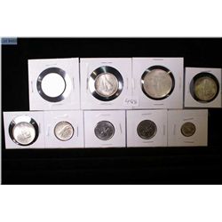 Selection of Canadian coins including 1967 dollar, four half dollars, quarter and dime plus two 1973