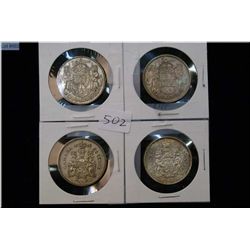 Four Canadian 50 cent pieces including 1952, 1958, 1960 and 1964