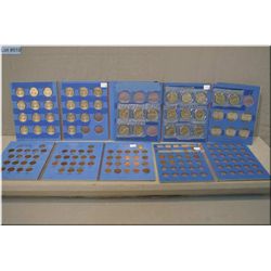 Four cards of Canadian coins including 1968 and higher $1 coins and 50 cent coins and a selection of