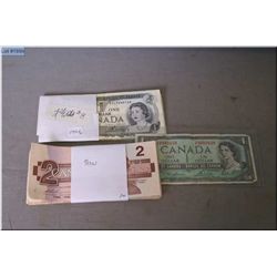 Eight 1973 Canadian $1 bills, twenty five 1986 Canadian $2 bills and one 1954 Canadian $1 bills