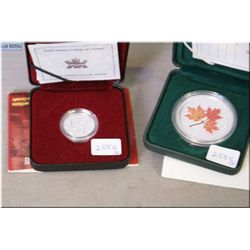 Two cased Canadian sterling coins including 2001 Royal Military college nickel and a 2001 Maple Leaf