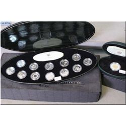 Cased Millennium coin set and a single Millennium cased coin, both sterling