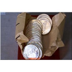 Twenty Canadian 1965 silver dollars in un-circulated condition