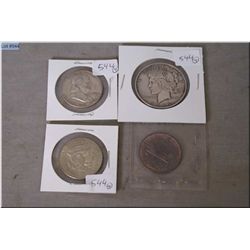 Four American coins including 1922 silver dollar, 1892, 1958, 1967 half dollars