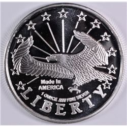 A ONE OUNCE .999 SILVER BULLION ROUND, WITH EAGLE /LIBERTY