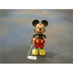A plastic wind up figure of Mickey Mouse £10-20...