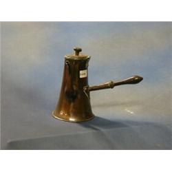 A 17th/18th Century copper side handled coffee pot with turned wooden handle £50-100...
