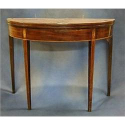 A Georgian inlaid mahogany demi-lune card table raised on square chamfered supports 38" £200-300...
