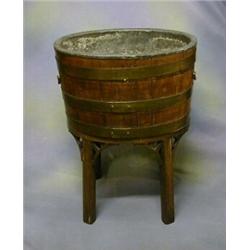 An 18th/19th Century oak oval coopered wine cooler with zinc lining and brass banding, raised on...