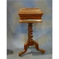 A Victorian mahogany teapoy raised on spiral turned and tripod supports 15"    £700-1000...