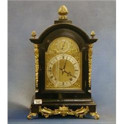 An Edwardian striking bracket clock the 6" arched brass dial with Roman numerals and silvered cha...