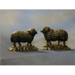 A pair of 19th Century cast iron door stops in the form of rams 7"  £40-60...
