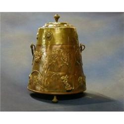 A 19th Century copper and brass Dutch coal bin raised on 3 bun supports   £40-60...