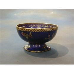 A Carltonware blue glazed lustre pedestal bowl decorated butterflies, the base marked RD No. 6616...