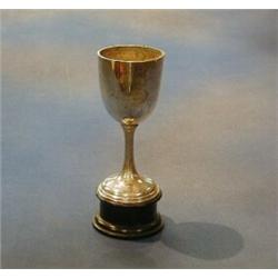 A silver goblet shaped trophy cup, Birmingham 1909 £10-20...