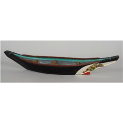 Haida Model Canoe with Painted Design 23 1/4" L. 5" W.  Good Condition and Four Painted Paddles 8" L