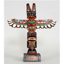 Chester Williams Totem Carved with Thunderbird and Bear Holding Human with a Presentation Plaque To 