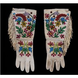 Pair of Northern Plains Beaded Fringed Gauntlets with Finely Beaded Floral Design ca. 1930  17" L. 7