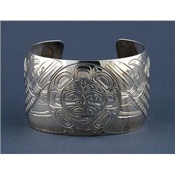 Northwest Coast Silver Bracelet with Incised Raven and Moon Design by W. Cooke 6 1/4" L. 1 1/2" W. 1