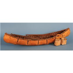 Large Birch Bark Model Canoe with Baskets, Paddles and Two Fishing Spears 33 1/4" L. 8 3/4" W.  All 